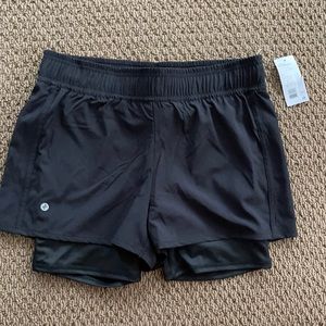 Women’s black shorts with Spandex liner